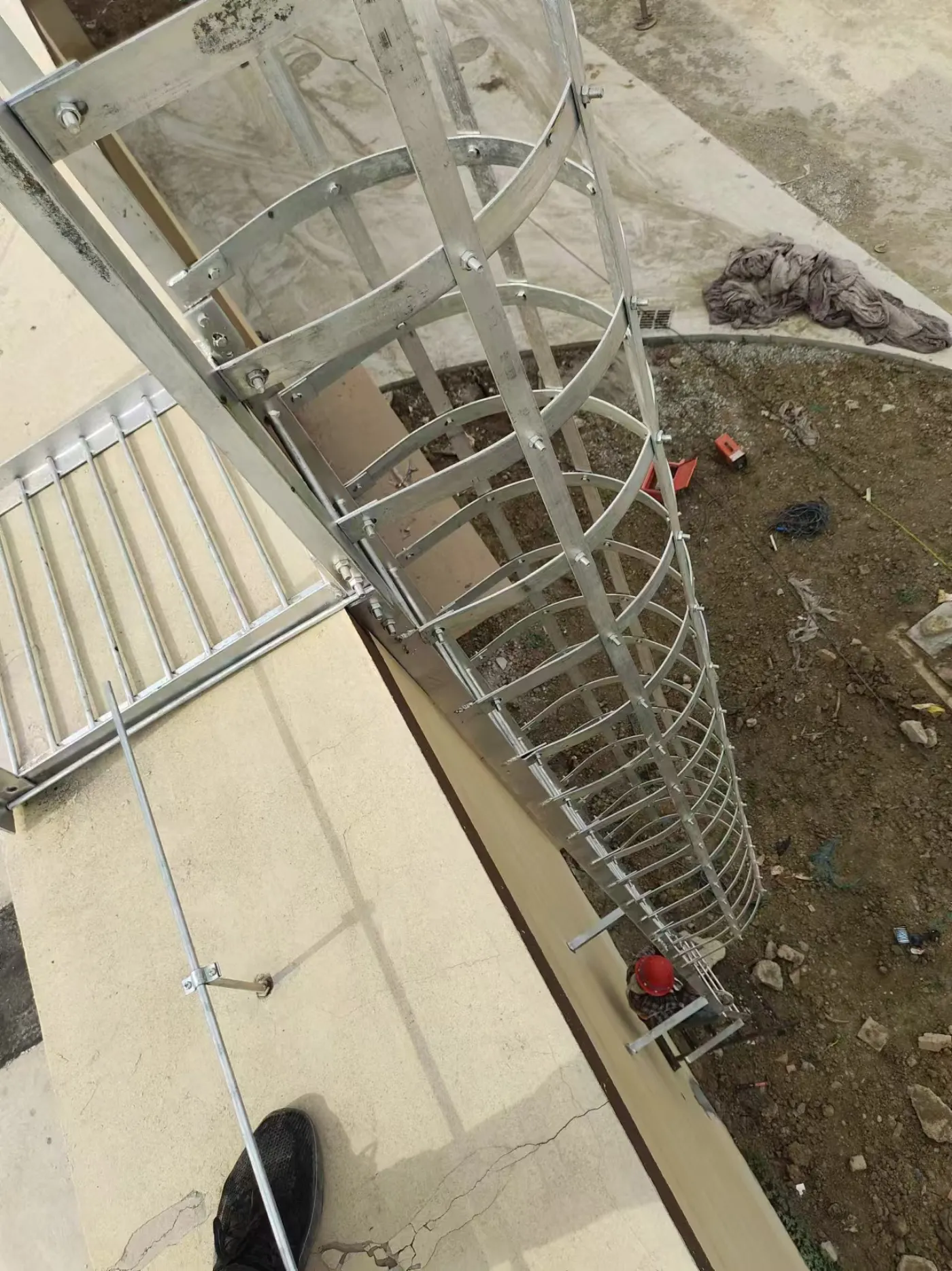Self-closing safety gate installed at cage ladder exit